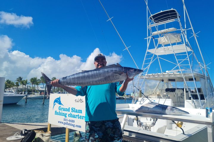 a man standing on a boat in the water