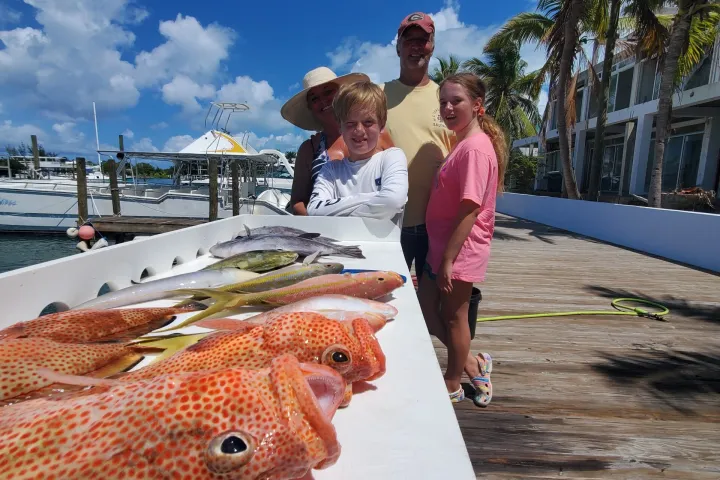 a man and a woman standing on a beach