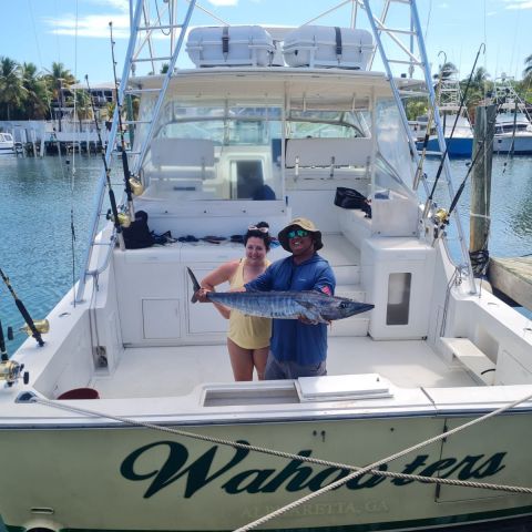 a group of people on a boat in the water