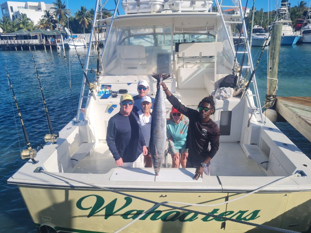 a group of people on a boat in the water