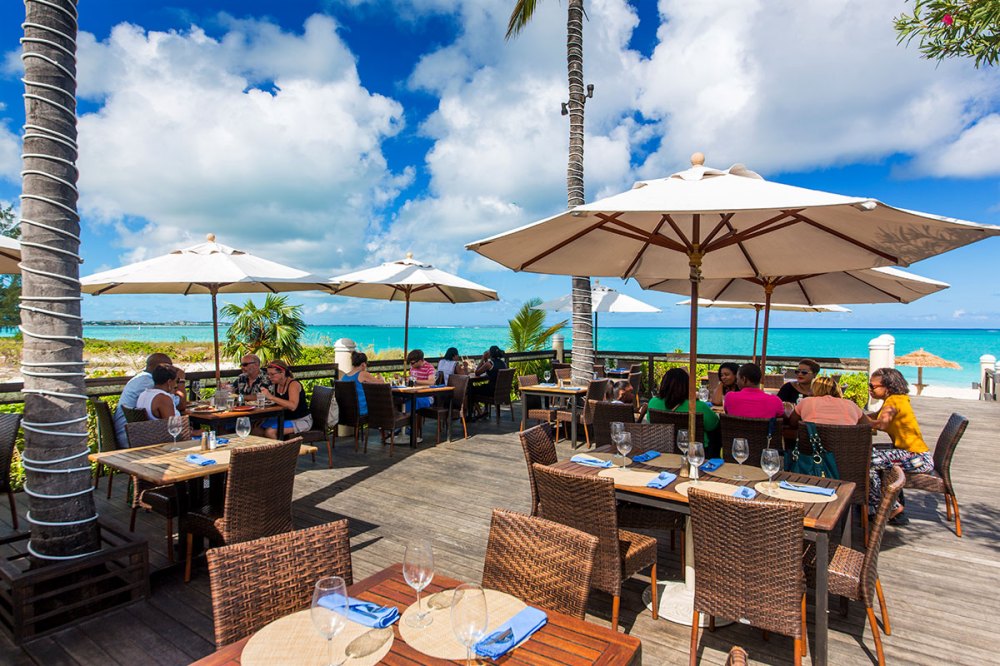 a table topped with a blue umbrella