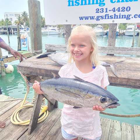 a person holding a fish