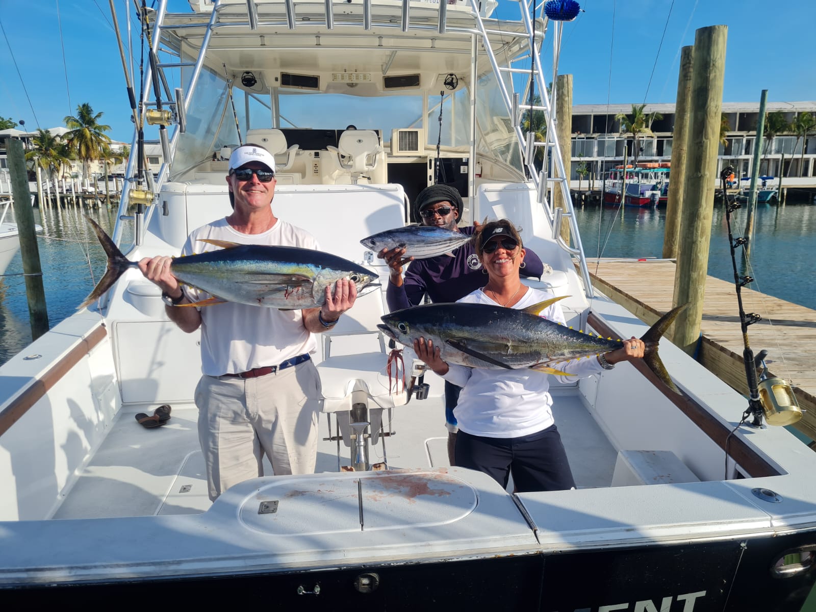a person holding a fish on a boat