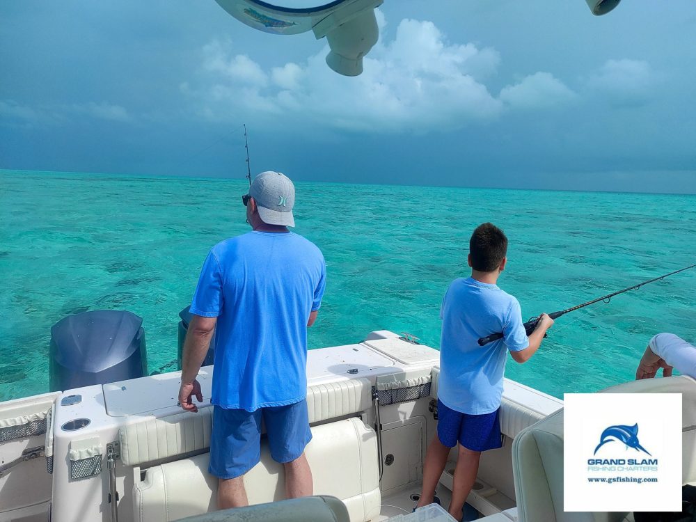 a man standing next to a body of water