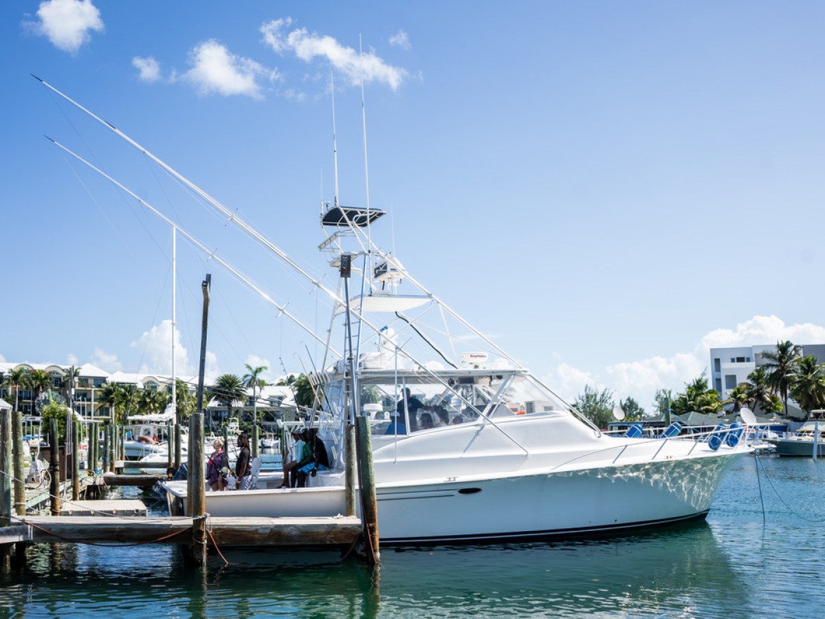 a boat is docked next to a body of water