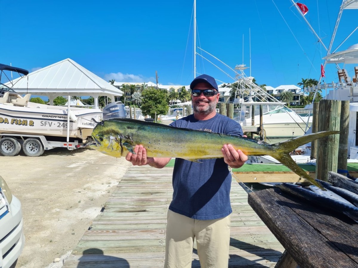 a man holding a fish