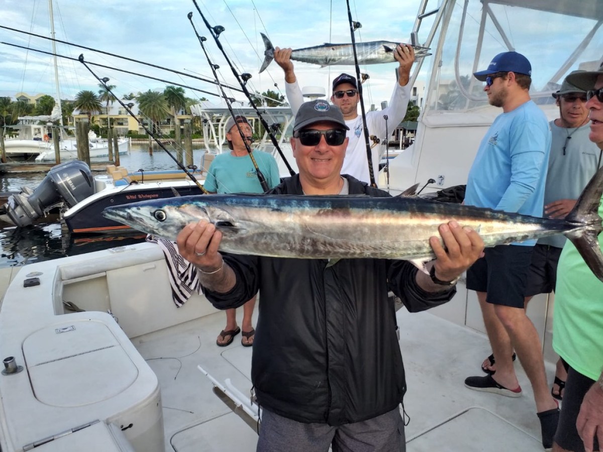 a man holding a fish