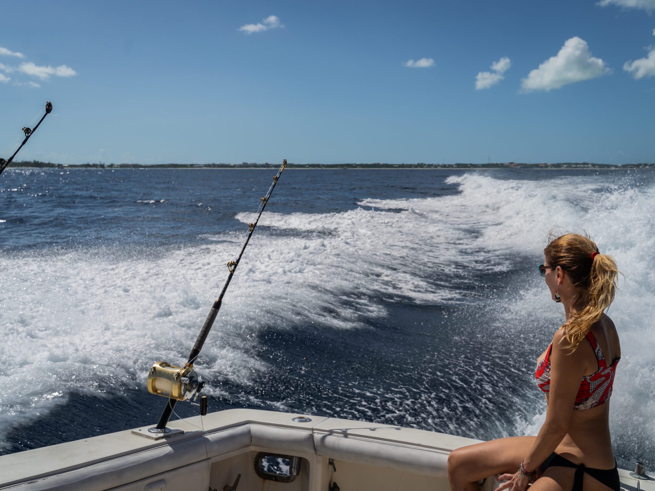 a person standing next to a body of water