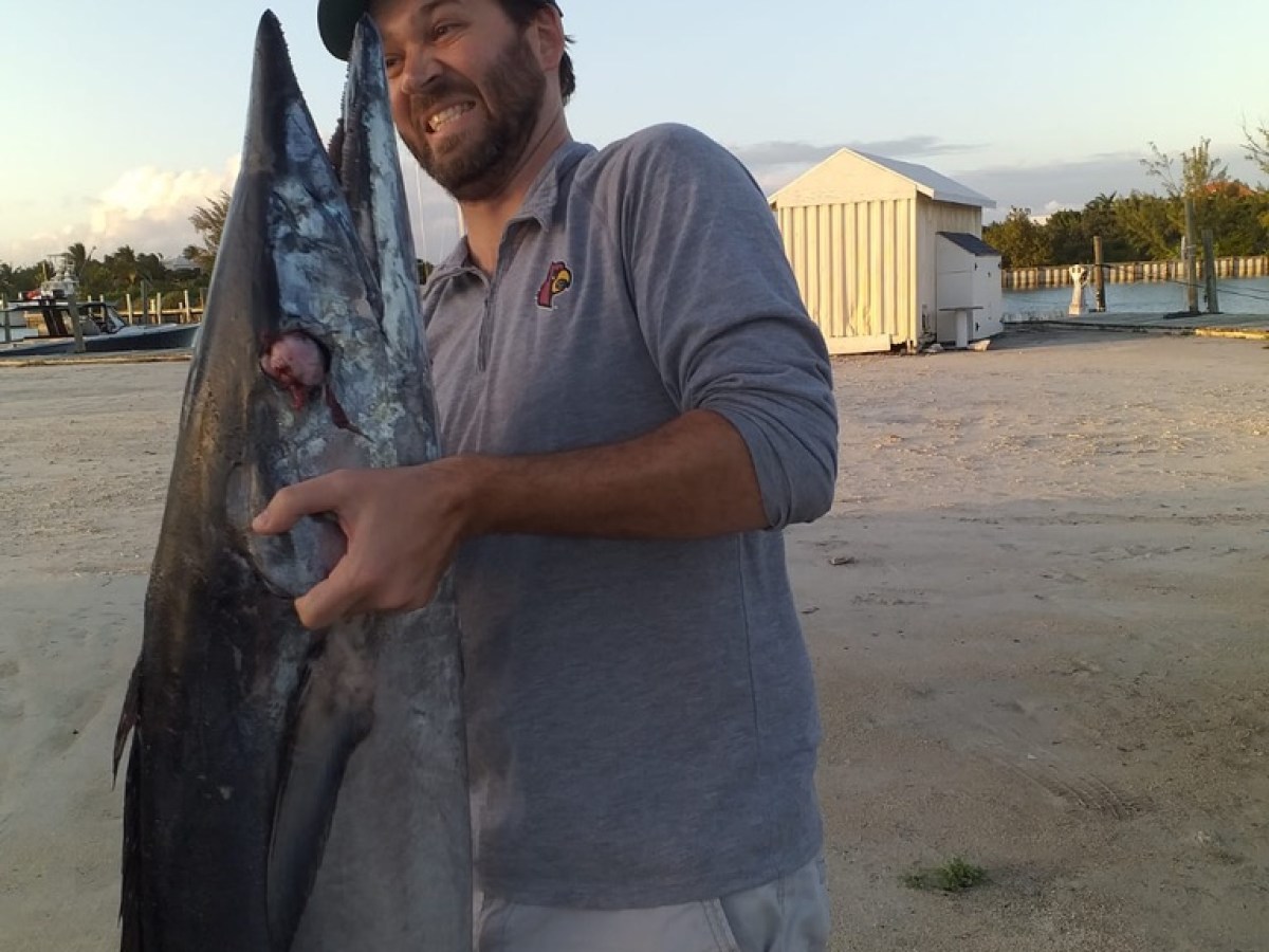 a man holding a fish