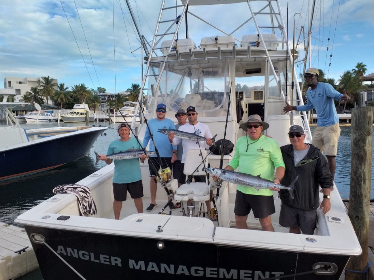 a group of people standing on a boat