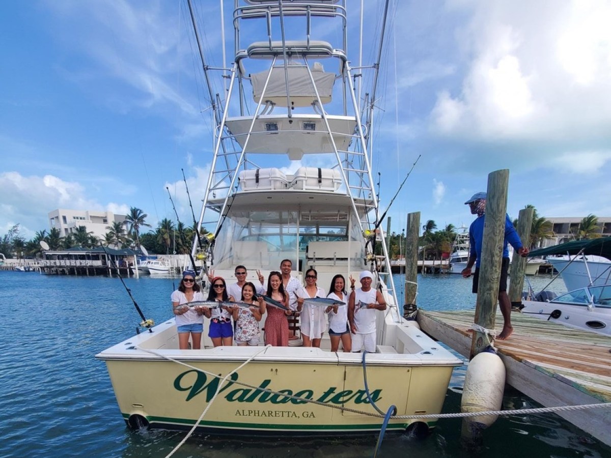a boat is docked next to a body of water