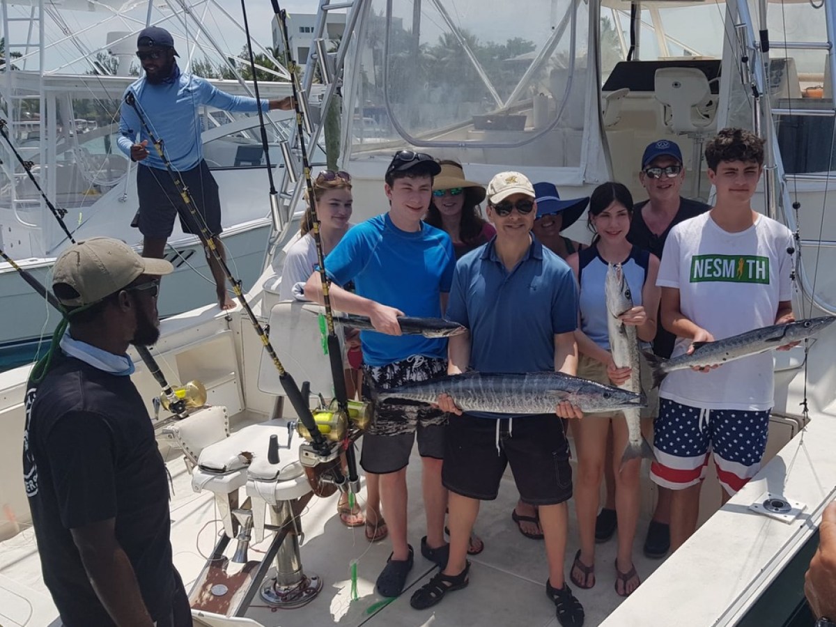 a group of people standing on a boat