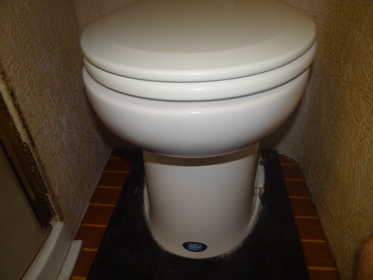 a bowl of food sitting on a tile floor