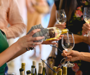 a woman drinking a glass of wine