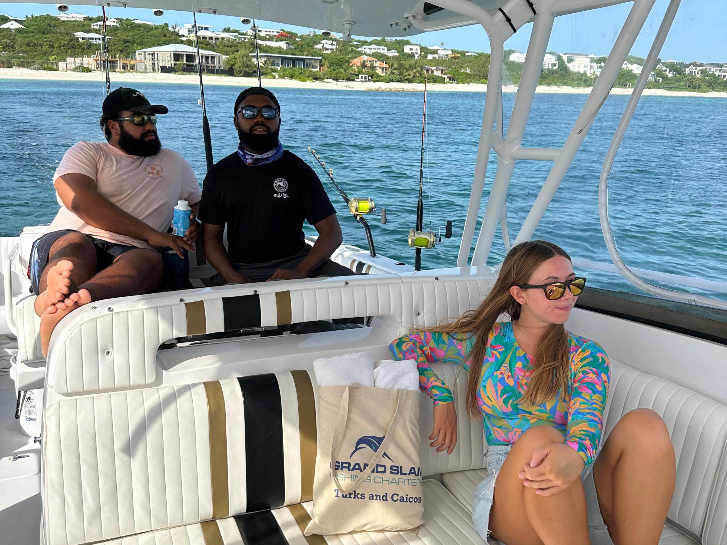 a group of people sitting on a boat