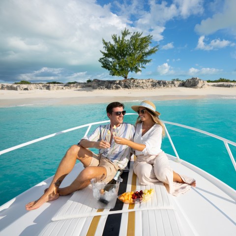 a person sitting in a boat on a body of water