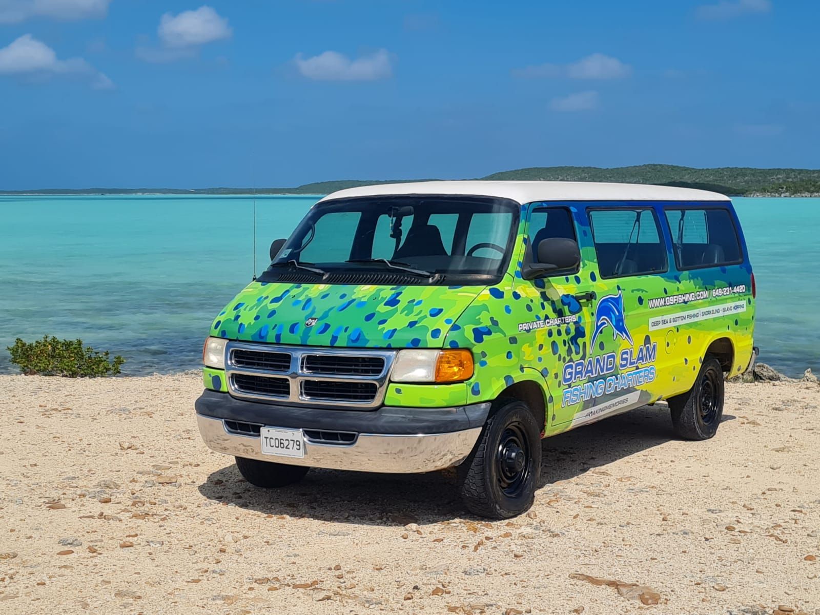 image1 a truck cake sitting on top of a sandy beach